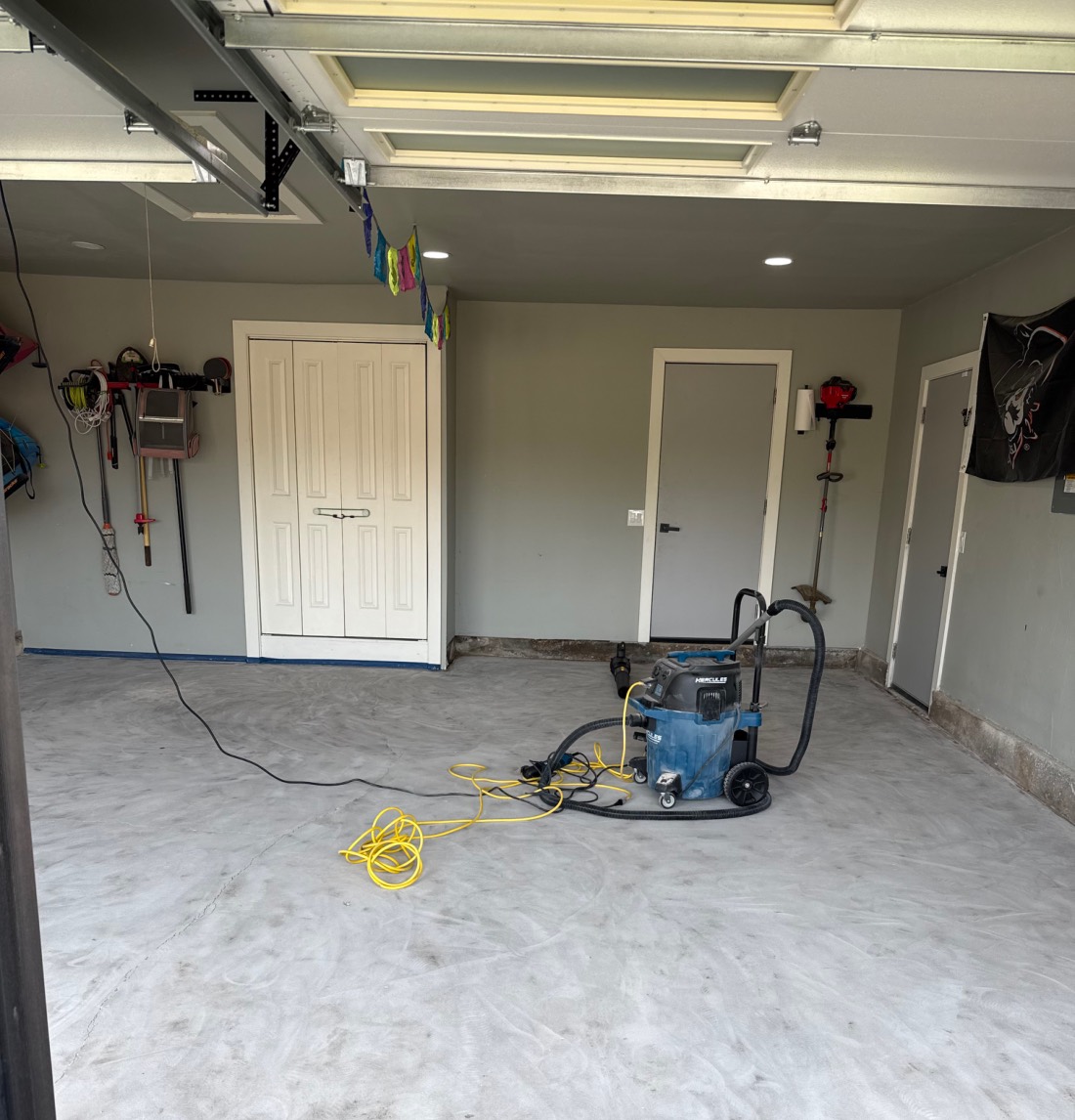 Two-car garage concrete slab after diamond grinding and surface preparation