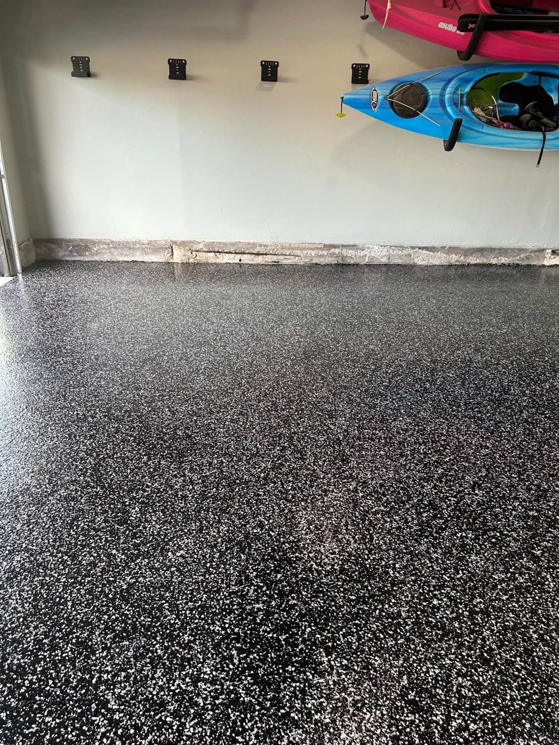 Finished flake garage floor along the side wall