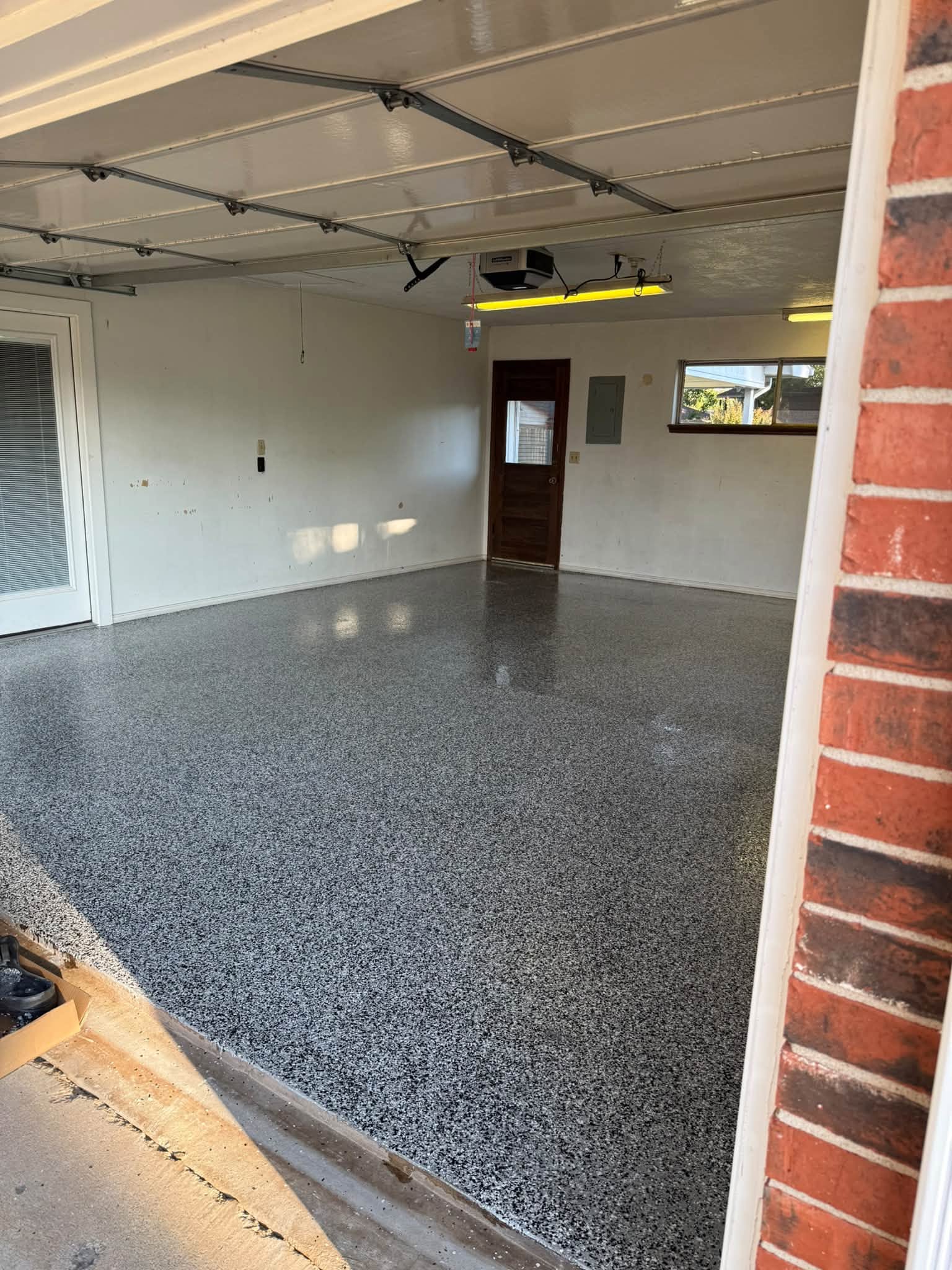 Finished Domino flake floor seen from the garage door