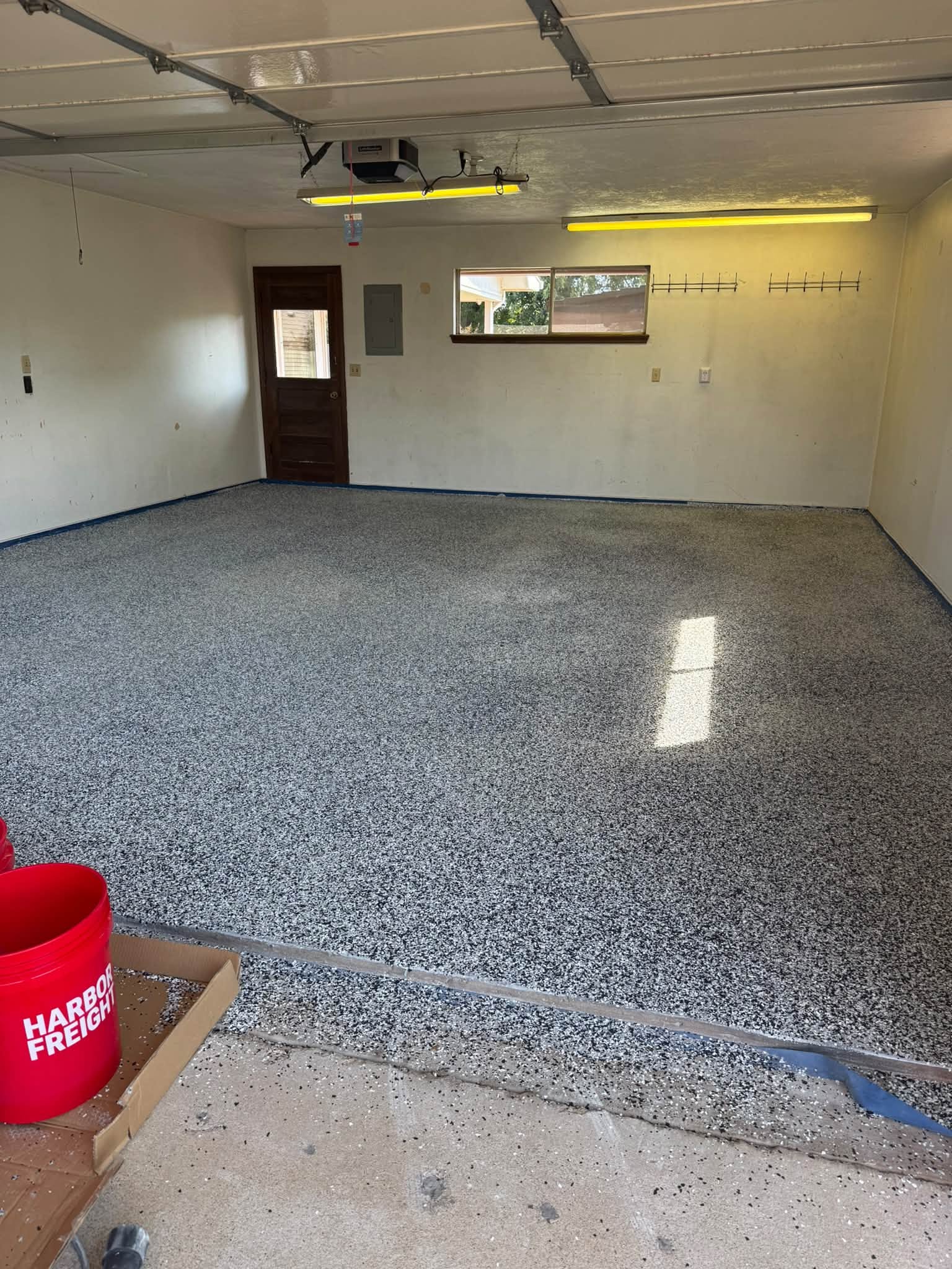 Finished two-car garage floor in Torginol Domino flake